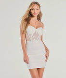 Andi Heat Stone Corset Dress, a trendy white mini dress featuring modern details and a fresh seasonal hue, perfect for creating chic 2025 looks.