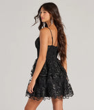 Stand out in a crowd with the Andrea Corset Floral Embroidered A-Line Party Dress, a glamorous black sequin dress that sparkles effortlessly as an NYE party gown, wedding guest dress, or must-have evening wear for formal events like military balls and winter formals.