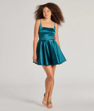 Make a bold statement in the Haidie Sleeveless A-Line Satin Party Dress in emerald green, the perfect green dress for weddings, cocktail hours, nights out, and/or seasonal celebrations.