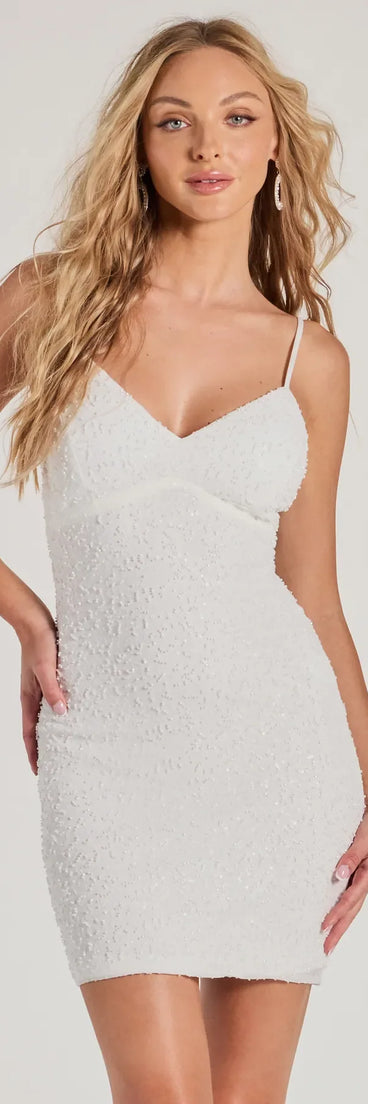 Turn heads in the beaming Eve Lace-Up Beaded Sequin Bodycon Mini Dress, a stunning white sequin dress designed to add sparkle and elegance to your next night out or special occasion.