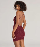 Make a statement in the brilliant Angie Rhinestone Strap Open Back Glitter Mini Dress, a glittery wine dress designed to shine at any occasion, from spring formals to elegant evening soirees.