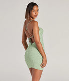 Shine with confidence, elegance, and standout style in the Keira Faux Pearl Strappy Open-Back Mini Dress—a sage green graduation dress designed with a fresh silhouette and the latest trends.