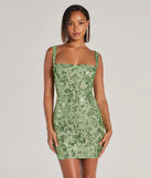 Turn heads in the beaming Aubree Lace-Up Sequin Party Dress, a stunning sage sequin dress designed to add sparkle and elegance to your next night out or special occasion.