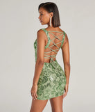 The Aubree Lace-Up Sequin Party Dress in sage is a stunning green prom dress designed to capture attention with its fresh or bold color and effortlessly stylish silhouette.