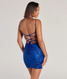 Stand out in a crowd with the Aitana Lace-Up Bodycon Sequin Mini Dress, a glamorous multicolor sequin dress that sparkles effortlessly as an NYE party gown, wedding guest dress, or must-have evening wear for formal events like military balls and winter formals.