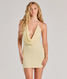 Step into seasonal chic with the Guinevere Beaded Cowl Halter Mini Dress, a sea foam mini dress featuring an above-the-knee cut ideal for cocktail parties, festive gatherings, or clubwear.