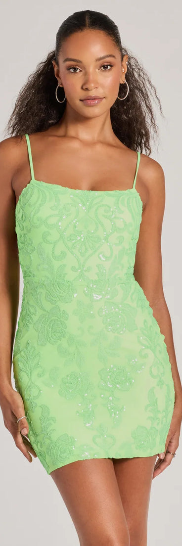 Turn heads in the beaming Tegan Cutout Bodycon Sequin Mini Dress, a stunning lime sequin dress designed to add sparkle and elegance to your next night out or special occasion.