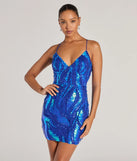 Turn heads at Prom 2025 in this royal blue prom dress, where statement-making details meet the iconic style of the Kitana V-Neck Lace-Up Sequin Formal Dress .