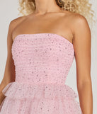 Step into winter chic with the Arie Strapless Rhinestone A-Line Party Dress, a pink mini dress featuring an above-the-knee cut ideal for cocktail parties, festive gatherings, or clubwear.