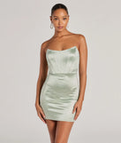 Step into seasonal chic with the Lily Strapless Corset Rhinestone Satin Mini Dress, a sage mini dress featuring an above-the-knee cut ideal for cocktail parties, festive gatherings, or clubwear.