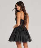 The Delani Sequin Corset Tulle A-Line Party Dress is a mini dress that will make a statement with its short hemline and on-trend details to have you ready for any event!