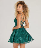 Stand out in a crowd with the Linda Lace-Up Glitter Sequin Skater Party Dress, a glamorous emerald sequin dress that sparkles effortlessly as an NYE party gown, wedding guest dress, or must-have evening wear for formal events like military balls and winter formals.