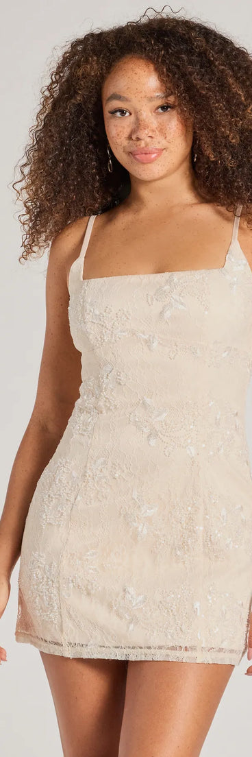 Turn heads in the beaming Odette Sequin Beaded Floral Lace Mini Dress, a stunning ivory sequin dress designed to add sparkle and elegance to your next night out or special occasion.
