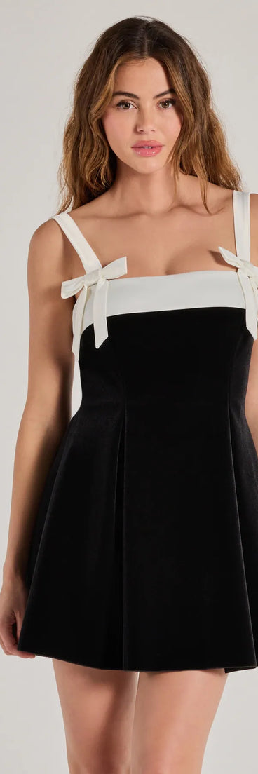 Keep it classic with the Marilyn Bow Strap Velvet Skater Dress, a feed-worthy pick from Windsor's black homecoming dress collection made to stop their scroll from pictures to the dance floor.