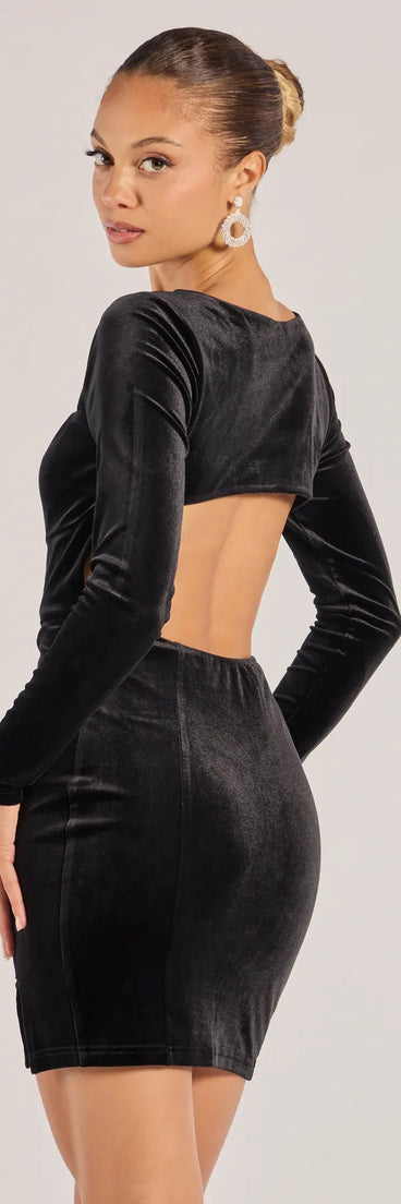 Flaunt your silhouette in the tight Adina Velvet Long Sleeve Open Back Mini Dress in black, a bodycon dress that empowers your look with bold style and effortless edge.