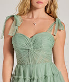 Revamp your 2025 wardrobe with this chic addition, the Lizzy Ruffled Glitter Mesh Skater Dress in sage green, perfect for elevating your style in the new year.