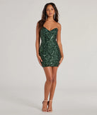 Make a bold statement in the Lilian Sequin Strapless Lace-Up Mini Dress in hunter green, the perfect green dress for weddings, cocktail hours, nights out, and/or seasonal celebrations.