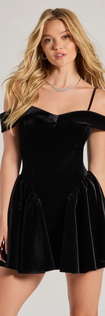 Andie Velvet Drop Waist Skater Dress, a trendy black mini dress featuring modern details and a fresh seasonal hue, perfect for creating chic 2025 looks.