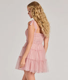 Own every entrance in the Lizzy Ruffled Glitter Mesh Skater Dress, a blush party dress perfect for milestone birthdays and grad parties, or dancing through summer nights and unforgettable bachelorette celebrations.