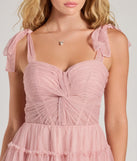 Revamp your 2025 wardrobe with this chic addition, the Lizzy Ruffled Glitter Mesh Skater Dress in blush, perfect for elevating your style in the new year.