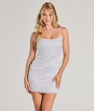 Turn heads in the beaming Skye Iridescent Sequin Fringe Bodycon Mini Dress, a stunning white sequin dress designed to add sparkle and elegance to your next night out or special occasion.