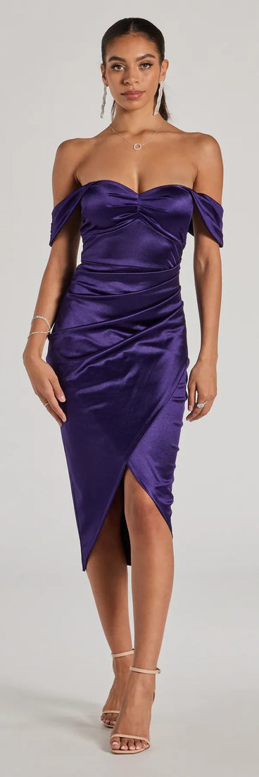 With its mid-calf hem and popular flattering fit, the Gaia Satin Off-The-Shoulder Wrap Midi Dress in purple nails the balance of trend and ease, redefining go-to midi dresses for any occasion.
