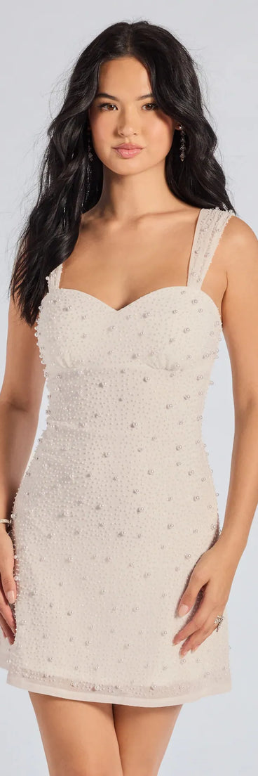 Shine with confidence, elegance, and standout style in the Miriam Pearl Beaded Formal Mini Dress—a white graduation dress designed with a fresh silhouette and the latest trends.
