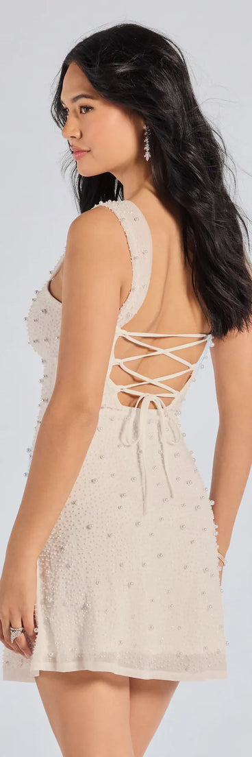 Own every entrance in the Miriam Pearl Beaded Formal Mini Dress, a white party dress perfect for milestone birthdays and grad parties, or dancing through summer nights and unforgettable bachelorette celebrations.