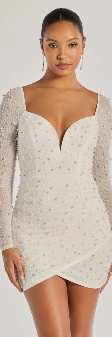 Own every entrance in the Emma Faux Pearl Beaded Long Sleeve Bodycon Dress, a white party dress perfect for milestone birthdays and grad parties, or dancing through weekend nights and unforgettable bachelorette celebrations.
