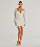 Make a bold statement in the Emma Faux Pearl Beaded Long Sleeve Bodycon Dress in white, the perfect spring dress for weddings, cocktail hours, nights out, and/or seasonal celebrations.