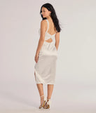 The Laina High Slit Satin Midi Dress in luxe white fabric, a stunning prom dress with statement details designed to make a bold impression at Prom 2025.