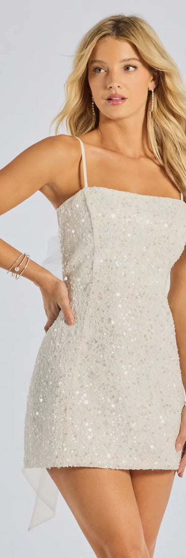 Own every entrance in the Kilah Bow Lace Sequin Mini Dress, a white party dress perfect for milestone birthdays and grad parties, or dancing through summer nights and unforgettable bachelorette celebrations.