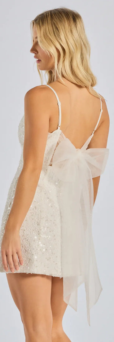 Own every entrance in the Kilah Bow Lace Sequin Mini Dress, a white party dress perfect for milestone birthdays and grad parties, or dancing through summer nights and unforgettable bachelorette celebrations.