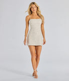 Make a bold statement in the Kilah Bow Lace Sequin Mini Dress in white, the perfect summer dress for weddings, cocktail hours, nights out, and/or seasonal celebrations.