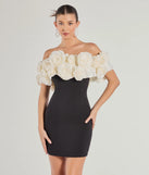 Turn heads at Prom 2025 in this black prom dress, where statement-making details meet the iconic style of the Nancy Off The Shoulder Floral Mini Dress .