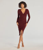 The Rhea Long Sleeve Wrap Glitter Midi Dress in burgundy is a modern red dress featuring trendy details and a stunning design ideal for wedding guest dresses, elegant cocktail looks, or an alluring Easter dress.