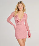 Turn heads at Prom 2025 in this mauve prom dress, where statement-making details meet the iconic style of the Bianca Long Sleeve Faux Pearl Beaded Mini Dress .