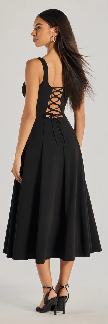 The Silvia Lace-Up Fit And Flare Midi Crepe Dress is a show-stopping black prom dress, offering a sleek, slimming silhouette that enhances your natural beauty for an unforgettable night.
