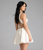 The Kimmie Lace-Up Corset Satin Skater Dress in ivory brings sleek style to any graduation outfit, from cap and gown to after-party.