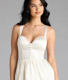 The Kimmie Lace-Up Corset Satin Skater Dress in ivory brings sleek style to any graduation outfit, from cap and gown to after-party.
