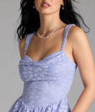 Soak up the season in the Selina Cutout Back Lace Glitter Skater Dress, a periwinkle sundress styled for easy days, outdoor plans, and everything in between.