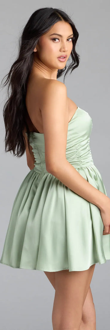 Own the spotlight in the Lorena Satin Strapless Skater Dress, a sage green formal dress crafted to deliver luxe style for fall weddings, military balls, or any special event.