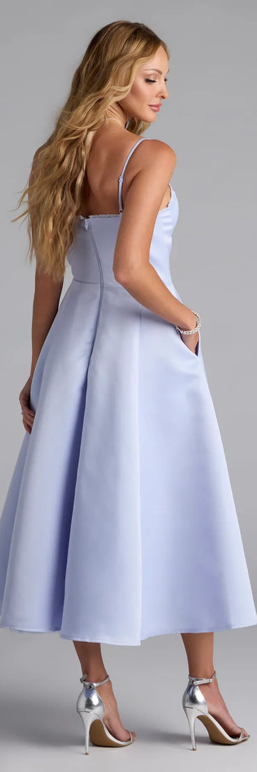 Own the spotlight in the Georgie Sweetheart A-Line Satin Midi Dress, a light blue formal dress crafted to deliver luxe style for autumn weddings, Military Balls, or any special event.
