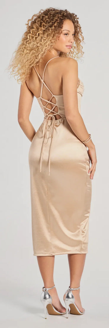 Flaunt your silhouette in the tight Heidi Corset Slit Satin Midi Dress in taupe, a bodycon dress that empowers your look with bold style and effortless edge.