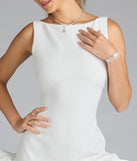 Flaunt your silhouette in the tight Ellerie Low Back Ruffle Bubble Short Dress in white, a bodycon dress that empowers your look with bold style and effortless edge.