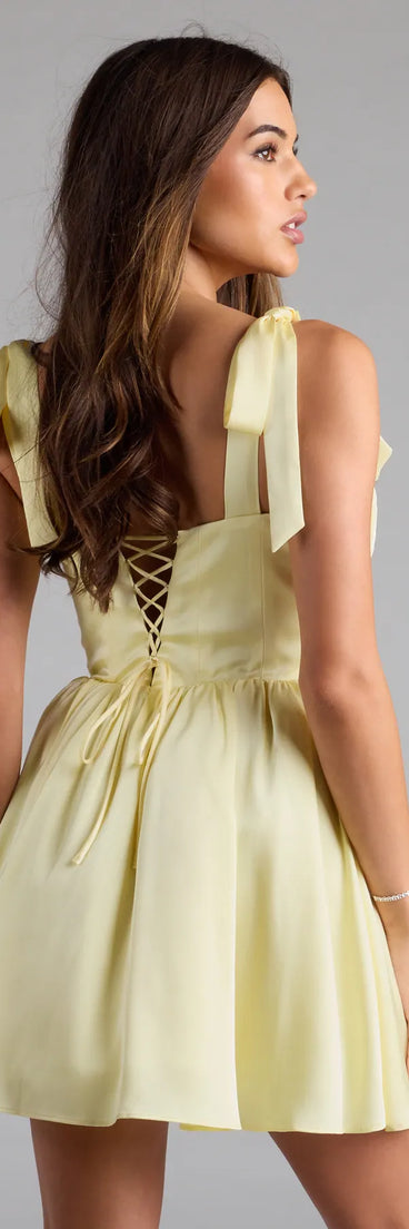 Own your moment in the Elida Lace-Up Skater Satin Short Dressin yellow, a standout 2025 Homecoming Dress that captures all the glam and energy of the night.