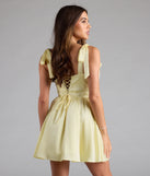 Shine with confidence, elegance, and standout style in the Elida Lace-Up Skater Satin Short Dress—a yellow graduation dress designed with a fresh silhouette and the latest trends.
