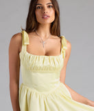 Shine with confidence, elegance, and standout style in the Elida Lace-Up Skater Satin Short Dress—a yellow graduation dress designed with a fresh silhouette and the latest trends.