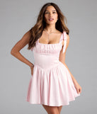 Shine with confidence, elegance, and standout style in the Elida Lace-Up Skater Satin Short Dress—a pink graduation dress designed with a fresh silhouette and the latest trends.