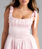 Shine with confidence, elegance, and standout style in the Elida Lace-Up Skater Satin Short Dress—a pink graduation dress designed with a fresh silhouette and the latest trends.